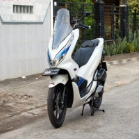 Jangan Salah Pilih! Ini Bedanya Honda PCX ABS dan CBS Buat Kamu yang Sering Touring!